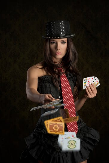 cute girl throwing poker cards